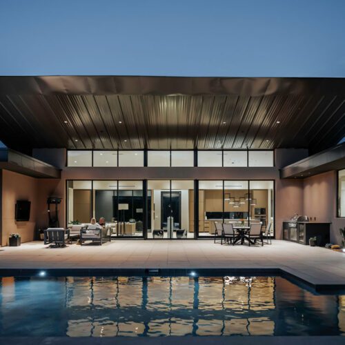 Modern desert home with expansive glass walls and cantilevered roof in Carefree, Arizona, designed by Spry Architecture