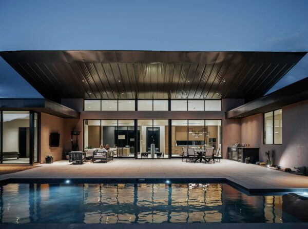 Modern desert home with expansive glass walls and cantilevered roof in Carefree, Arizona, designed by Spry Architecture